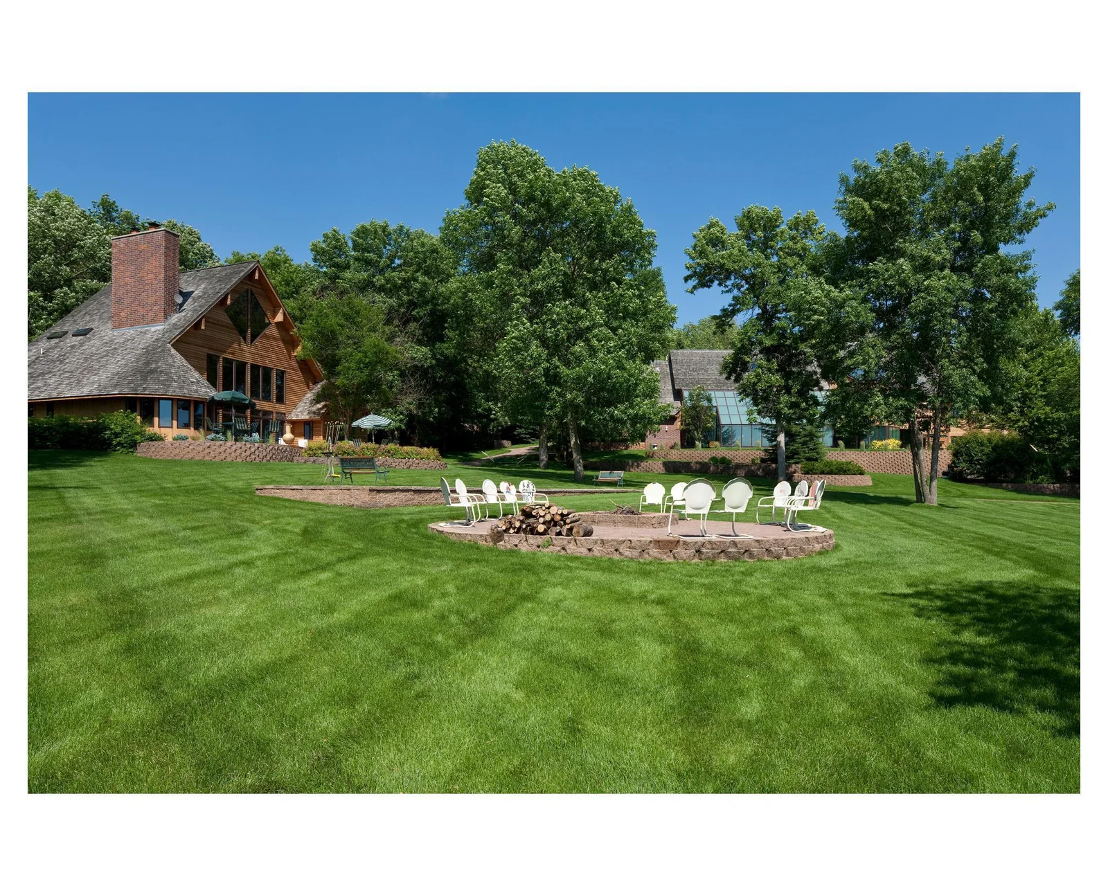 Views from the lake looking at the firepit with the St. Francis House on the left and the Mary Hill Lodge on the right