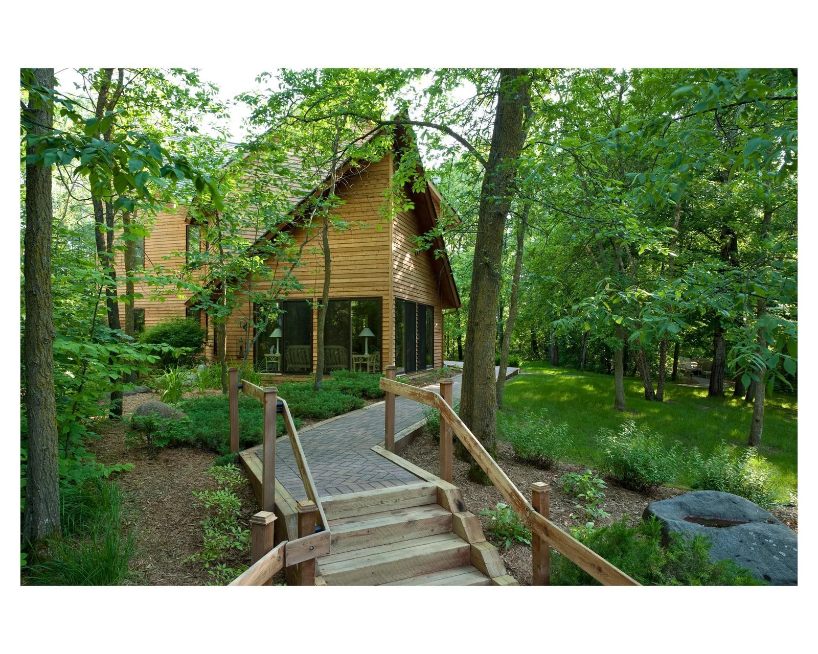 St. Anne is a cozy 3,448 sq. ft. three bedroom, three and one-half bath home tucked away in the woods but only a few seconds golf cart ride from the beach and lake
