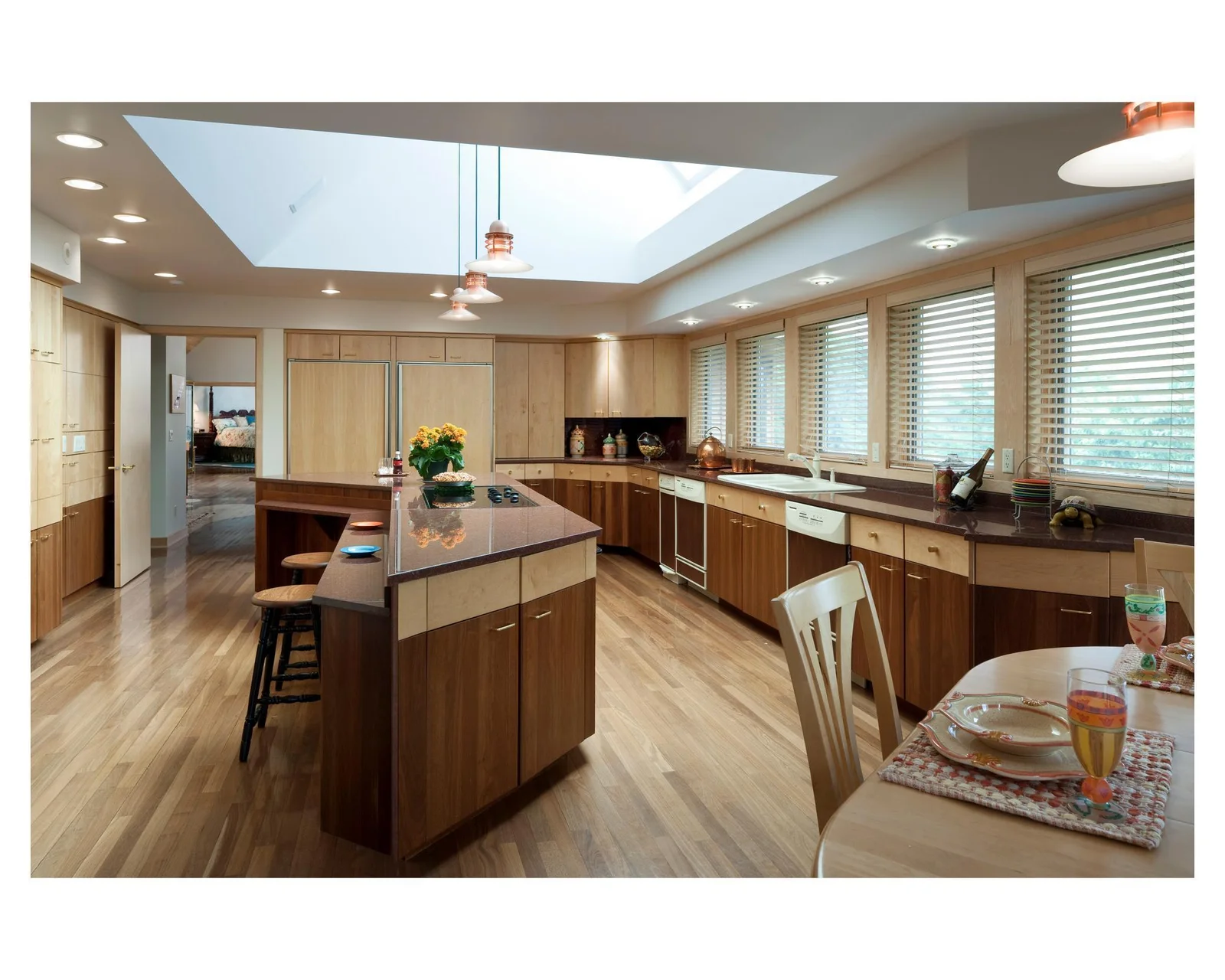 Custom two-tone wood cabinets in the extra large Mary Hill kitchen