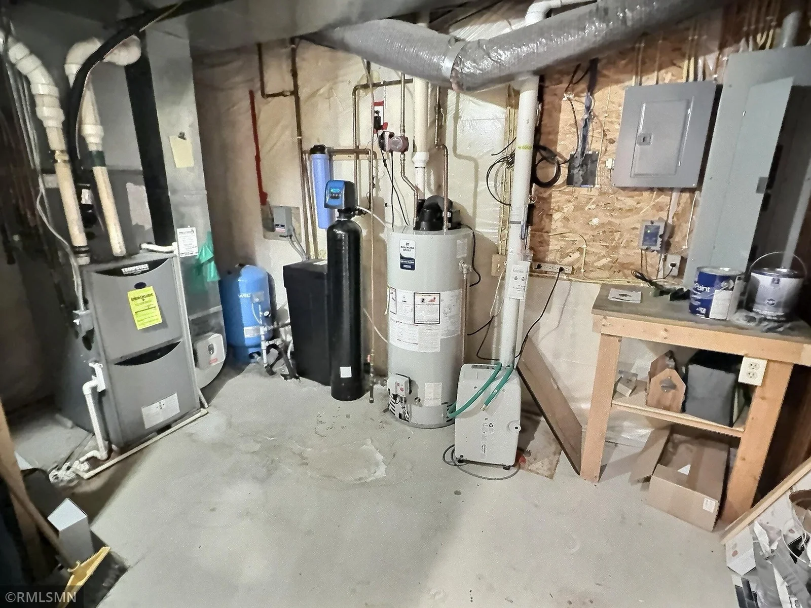 View of the lower level utility room. The lower level also has a recently finished three-quarter bathroom.