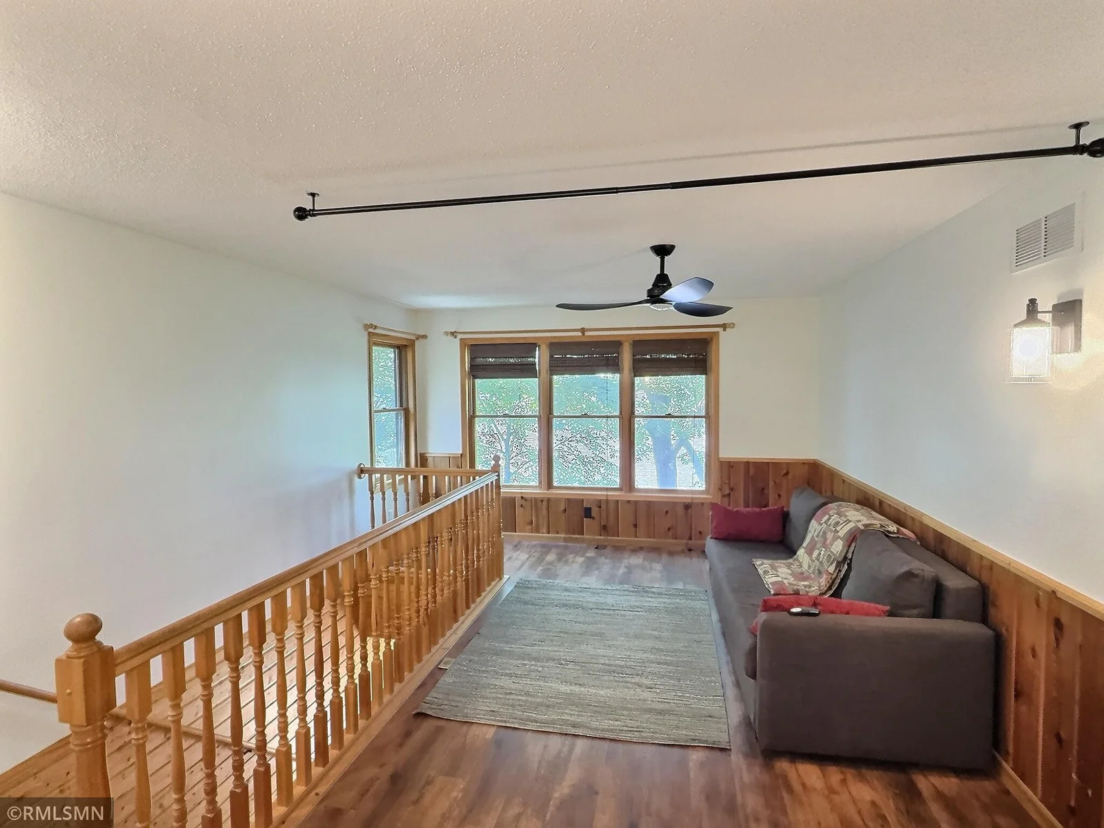 As you enter the upper level of the home, you'll find the den perfect for relaxing and taking in the lake views.
