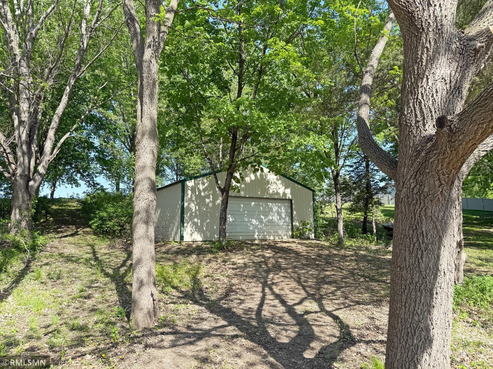 With an additional garage on a back lot, you will have more than enough storage space along with a level lawn.
