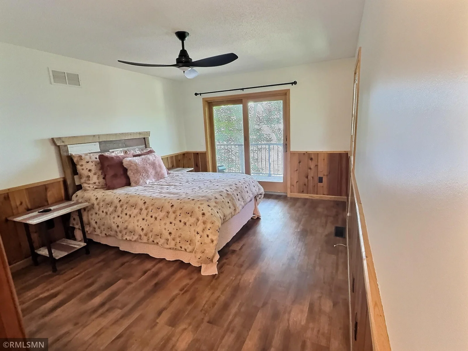 Your own little sanctuary, the primary bedroom features a private deck showcasing gorgeous Cedar Lake views.