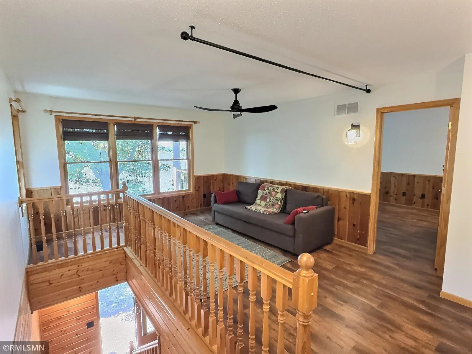 Another view of the den, the primary bedroom is to the left. The 2nd bedroom and bathroom is down the hall.