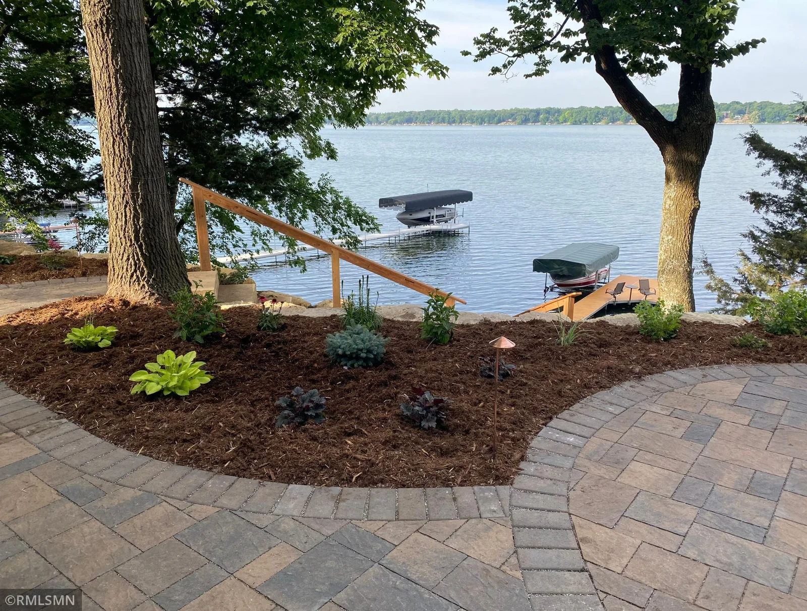 Stunning landscaping creates a showcases gorgeous views of the Cedar Lake shoreline anytime of the year!