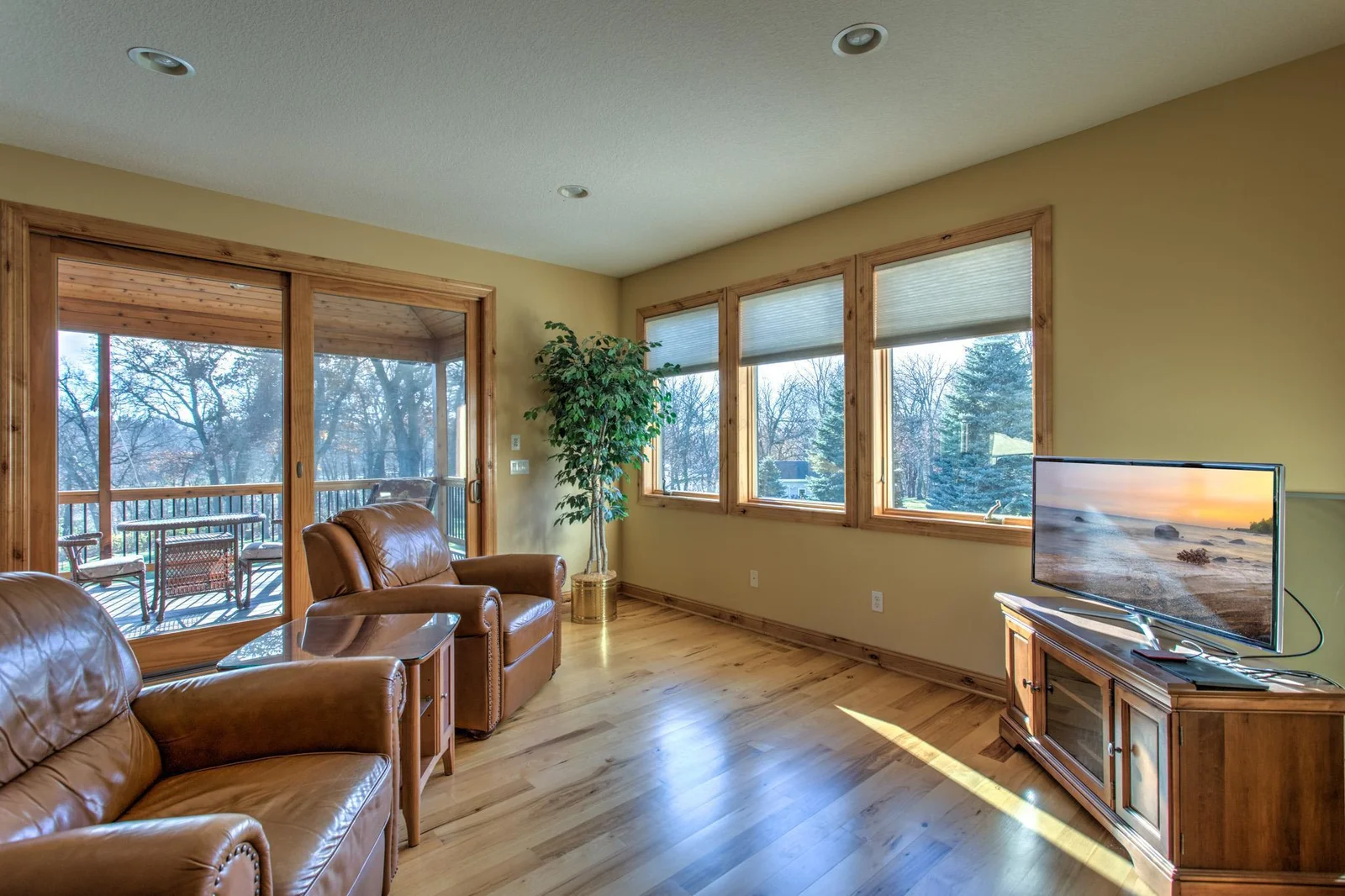 Sitting room with patio door to 3 season porch