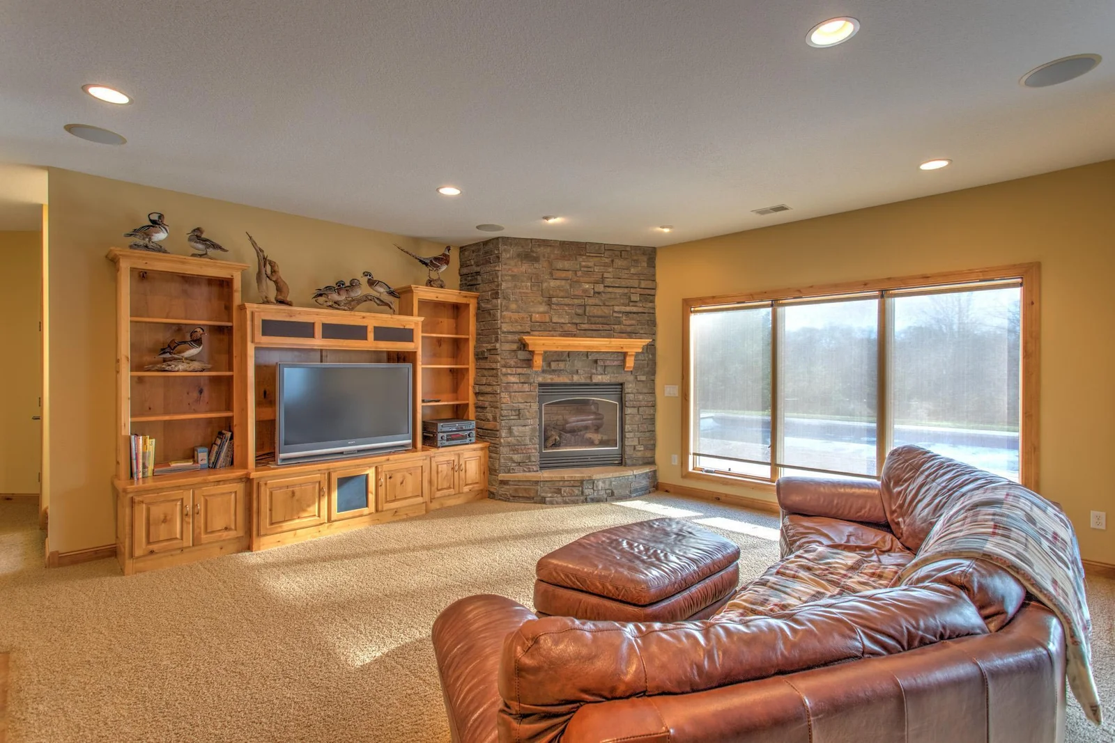 Stacked stone hearth and gas fireplace
