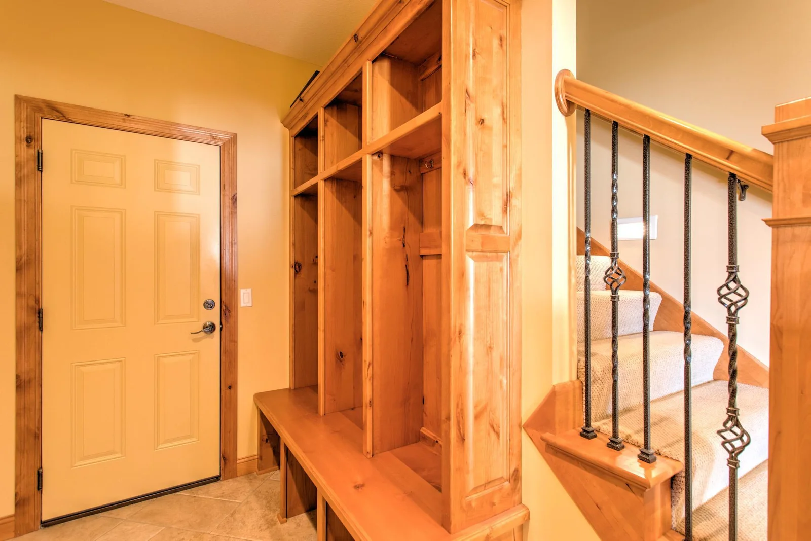 Mud room off the garage with built-ins