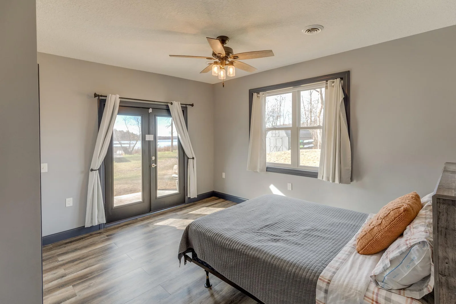 Main floor bedroom with a walkout to the patio.