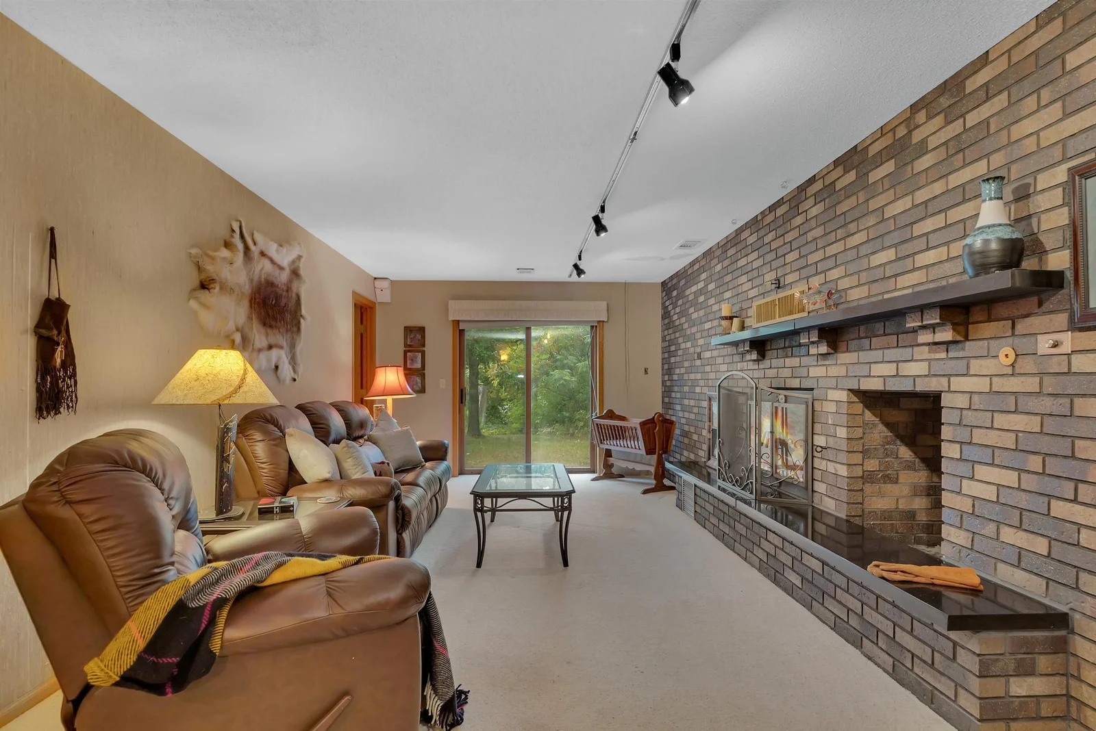 The feature fireplace wall is a true statement of rustic beauty