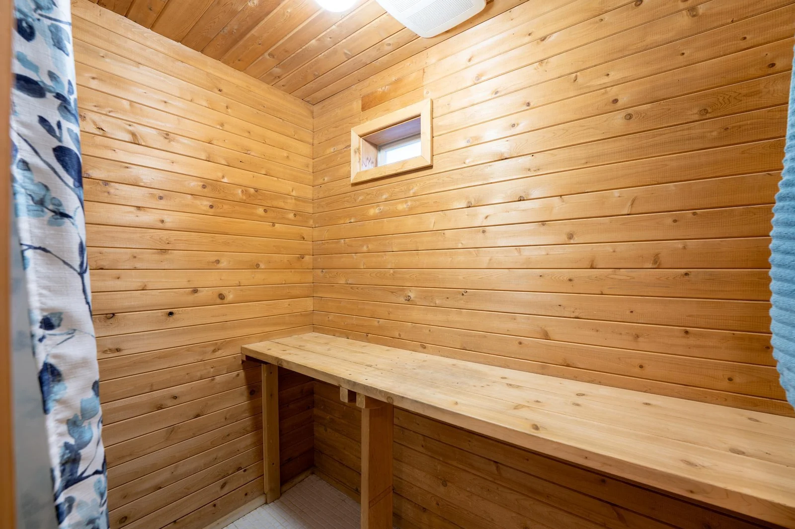 Main floor bath with cedar wired for sauna