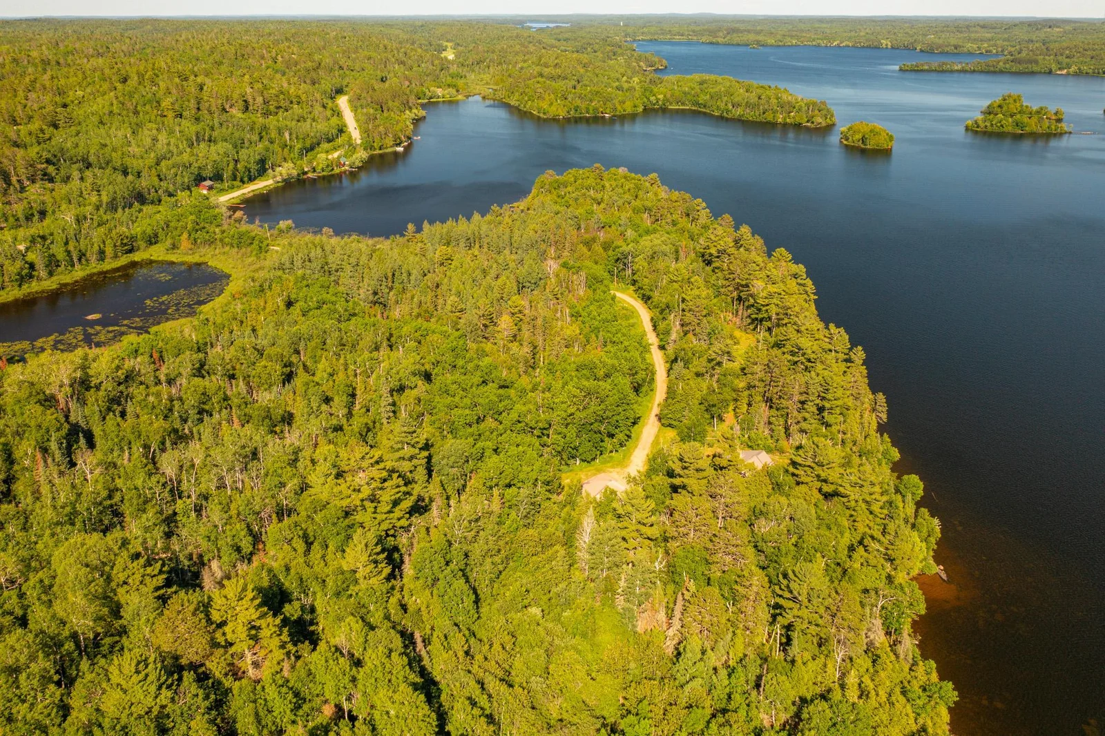 Secluded peninsula with a gravel road leading to home