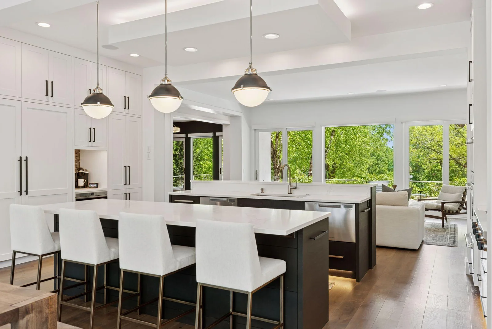 2 huge islands define dining/kitchen/living spaces on the main level