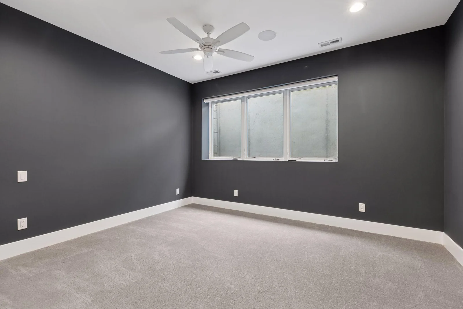 Lower level bedroom makes a great workout room or Au Pair quarters adjacent to 3/4 bath