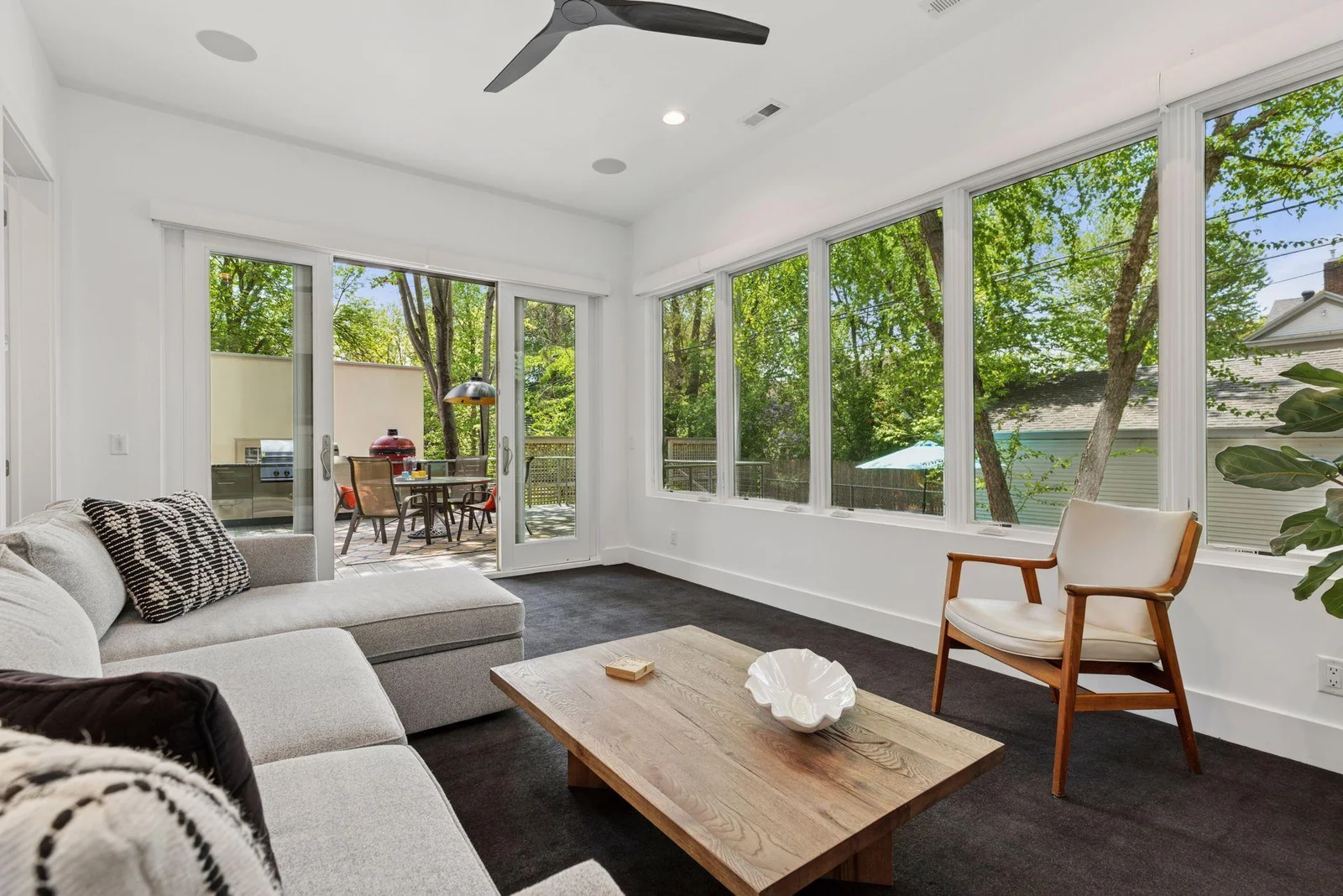 Main level sunroom with access to deck