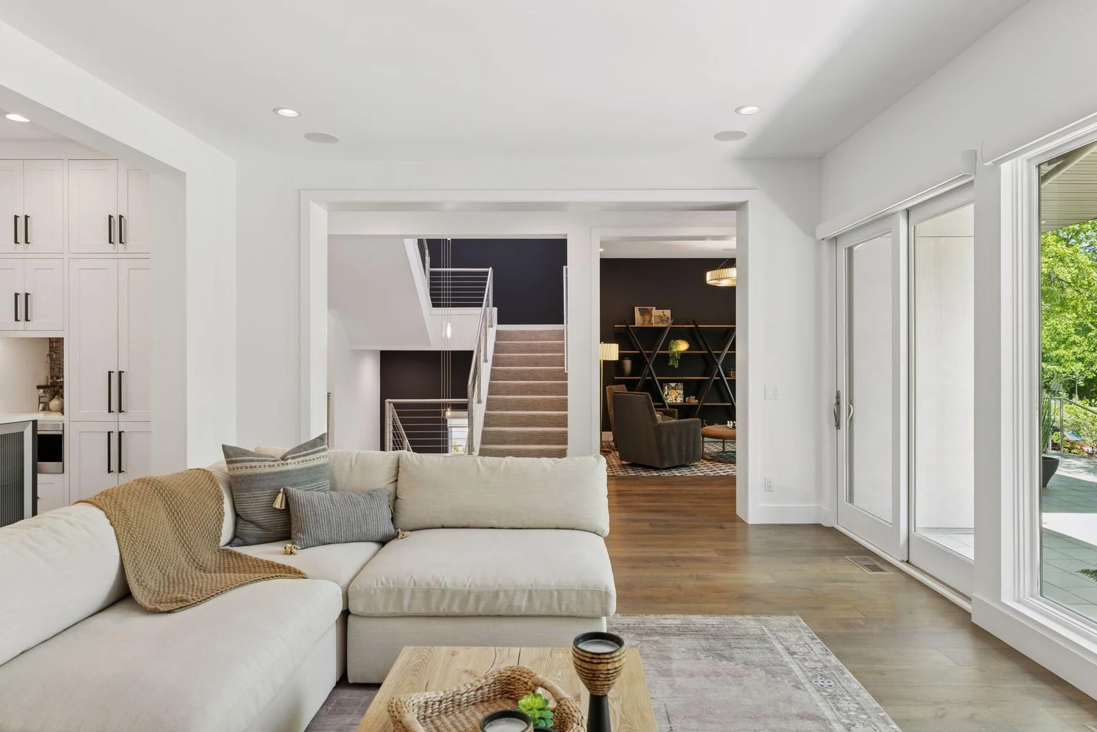 Open concept living area adjacent to sitting room