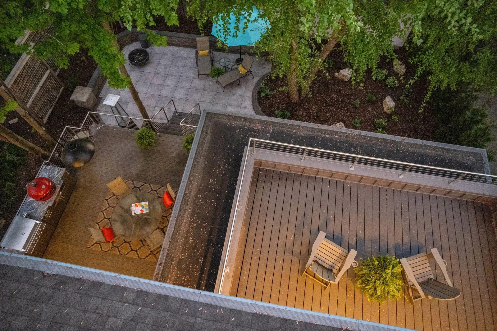 Overhead view of 3 separate outdoor living spaces in back
