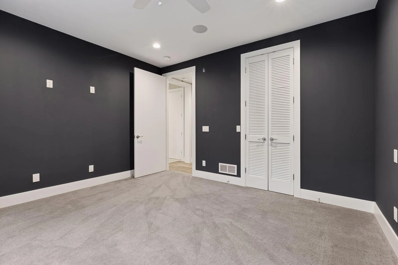 Lower level bedroom makes a great workout room or Au Pair quarters adjacent to 3/4 bath
