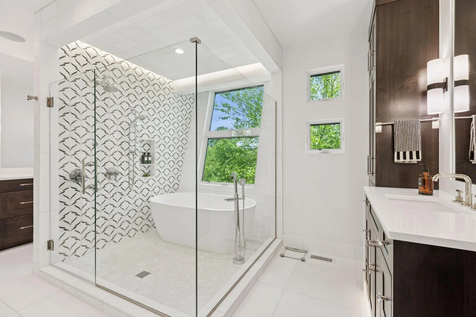 Primary bath with "his/hers" vanities and separate toilet room