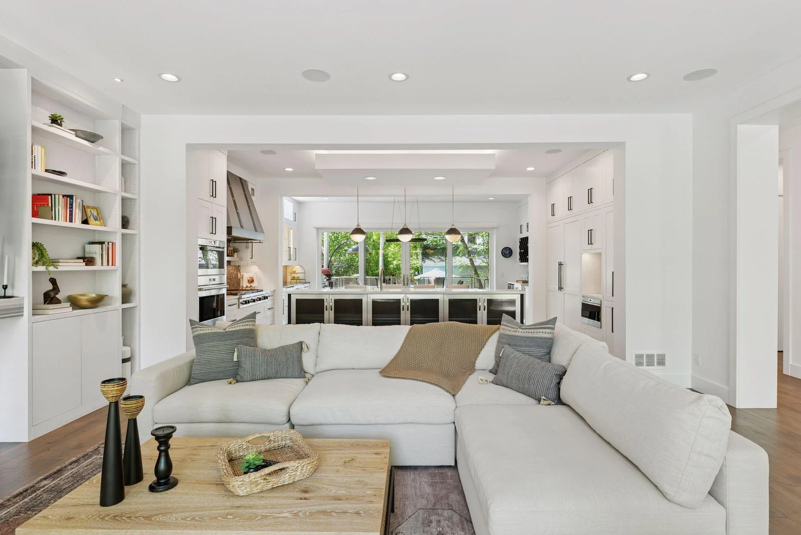 Living room open to kitchen/dining/outdoor spaces