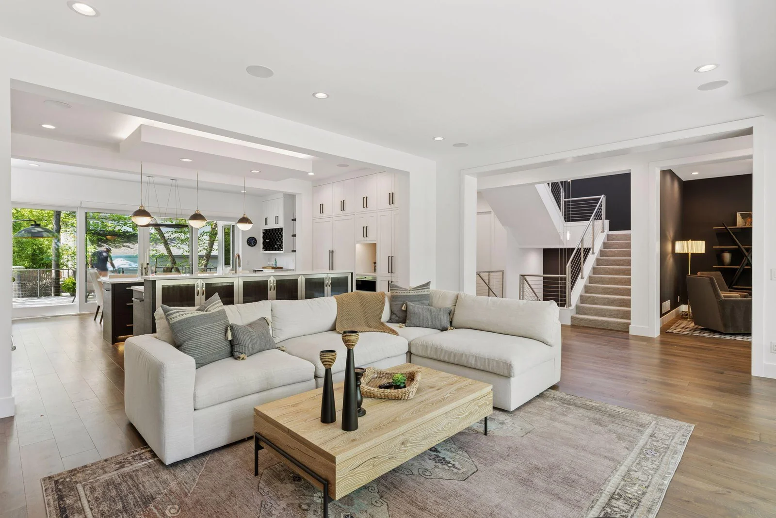 Living room open to kitchen/dining/outdoor spaces