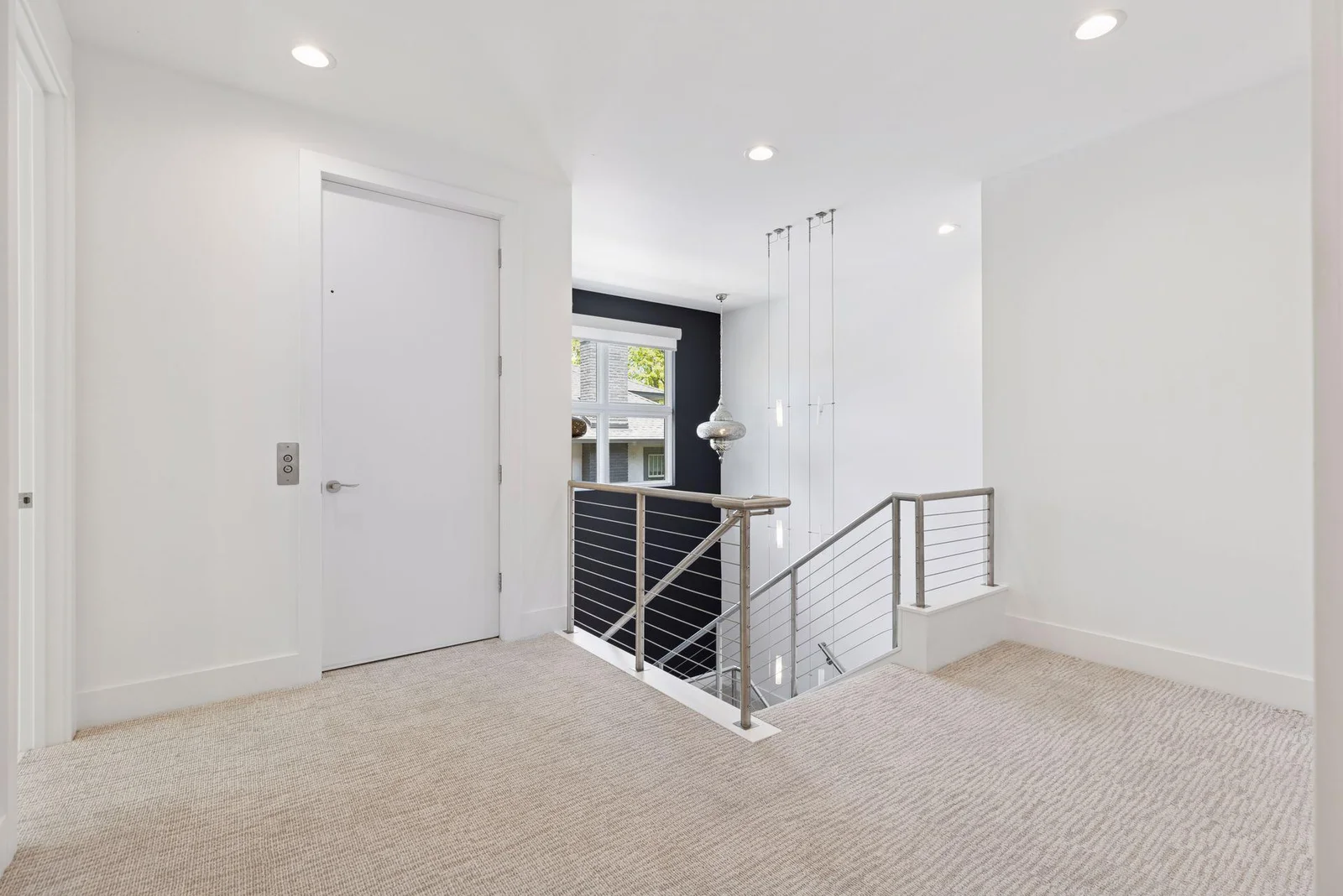 Upper level landing with elevator access