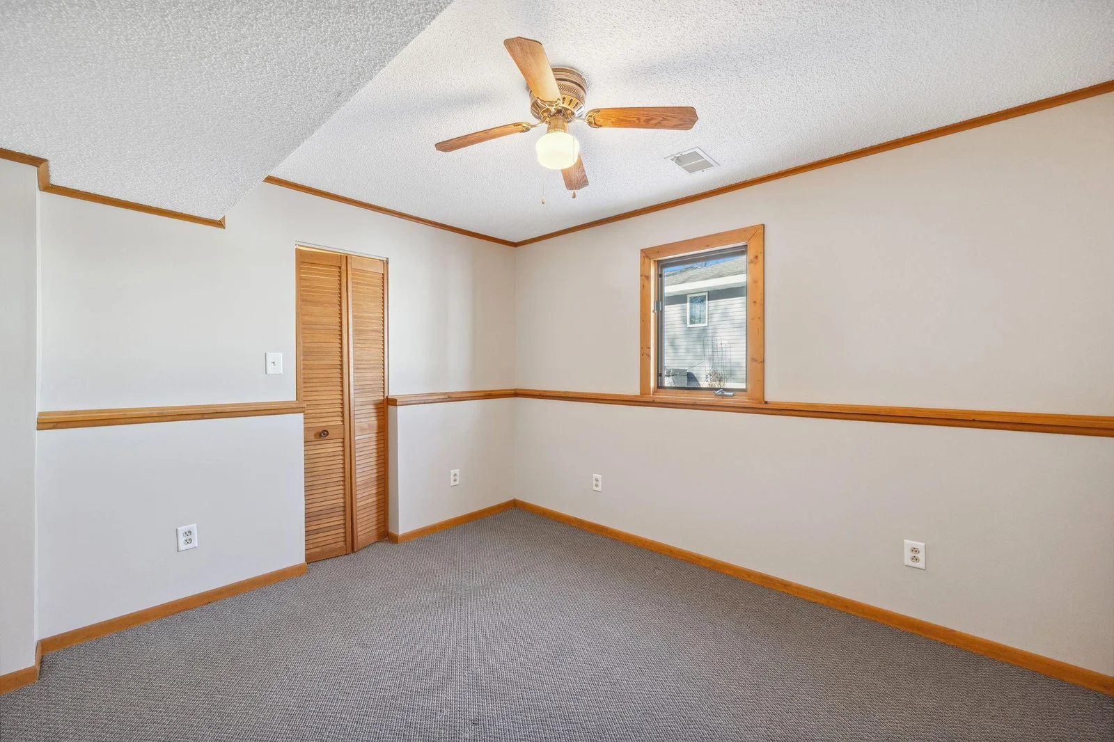 Main floor bedroom offers a large walk-in closet
