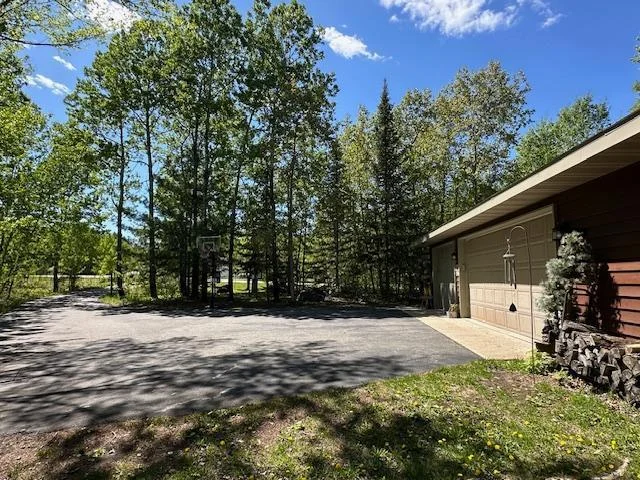 Inviting driveway to your oversized 3 stall garage