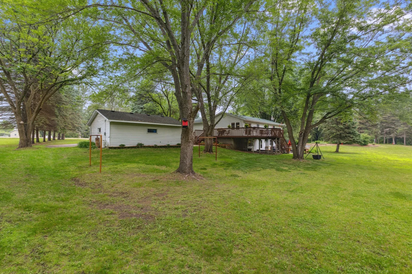 Large yard with garden areas.