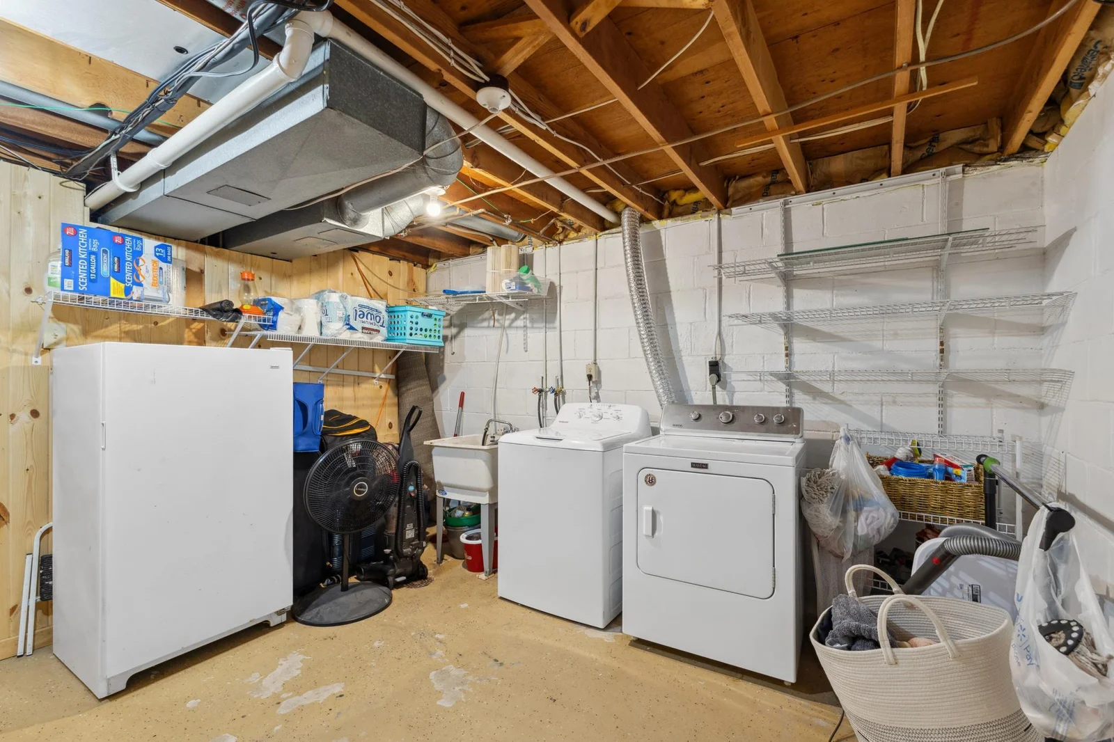 spacious utility/laundry room with storage area.