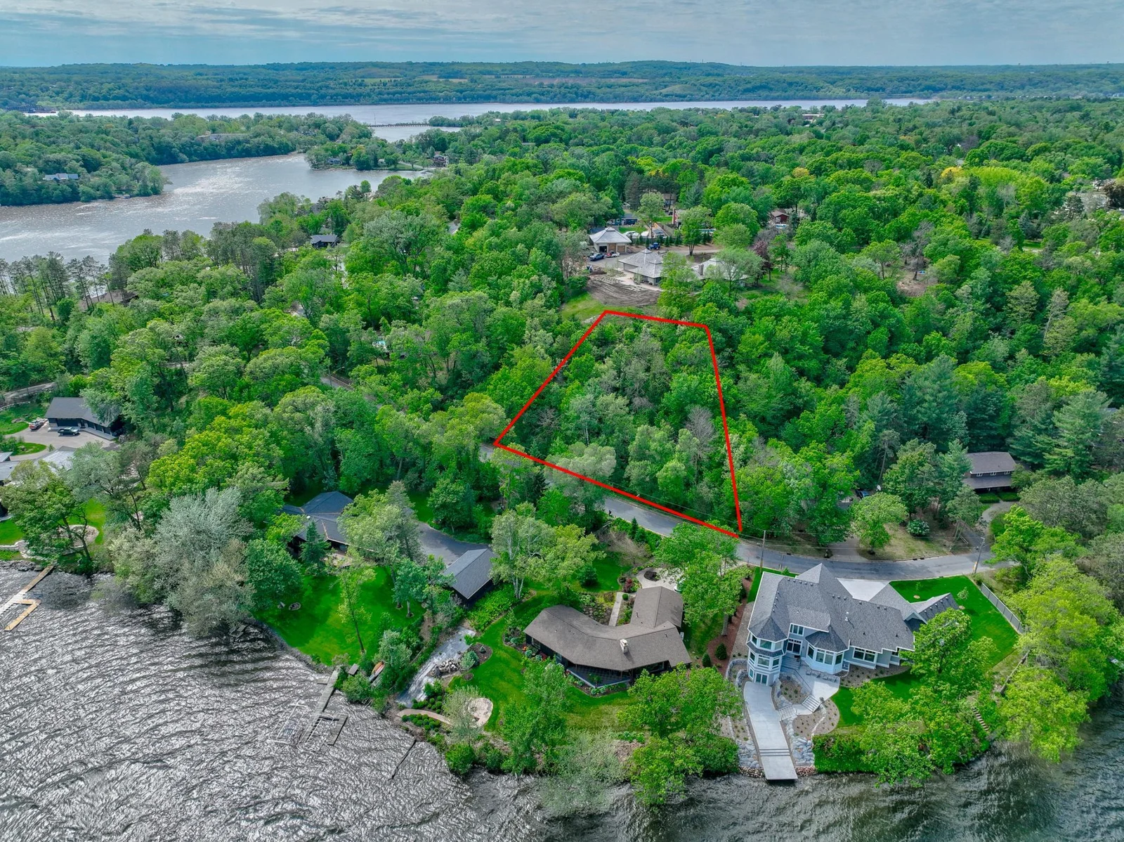 Overlooking the scenic Lake Mallalieu, this private, wooded lot sits on a quiet dead-end road in a mature neighborhood, making it the perfect canvas for the home of your dreams!