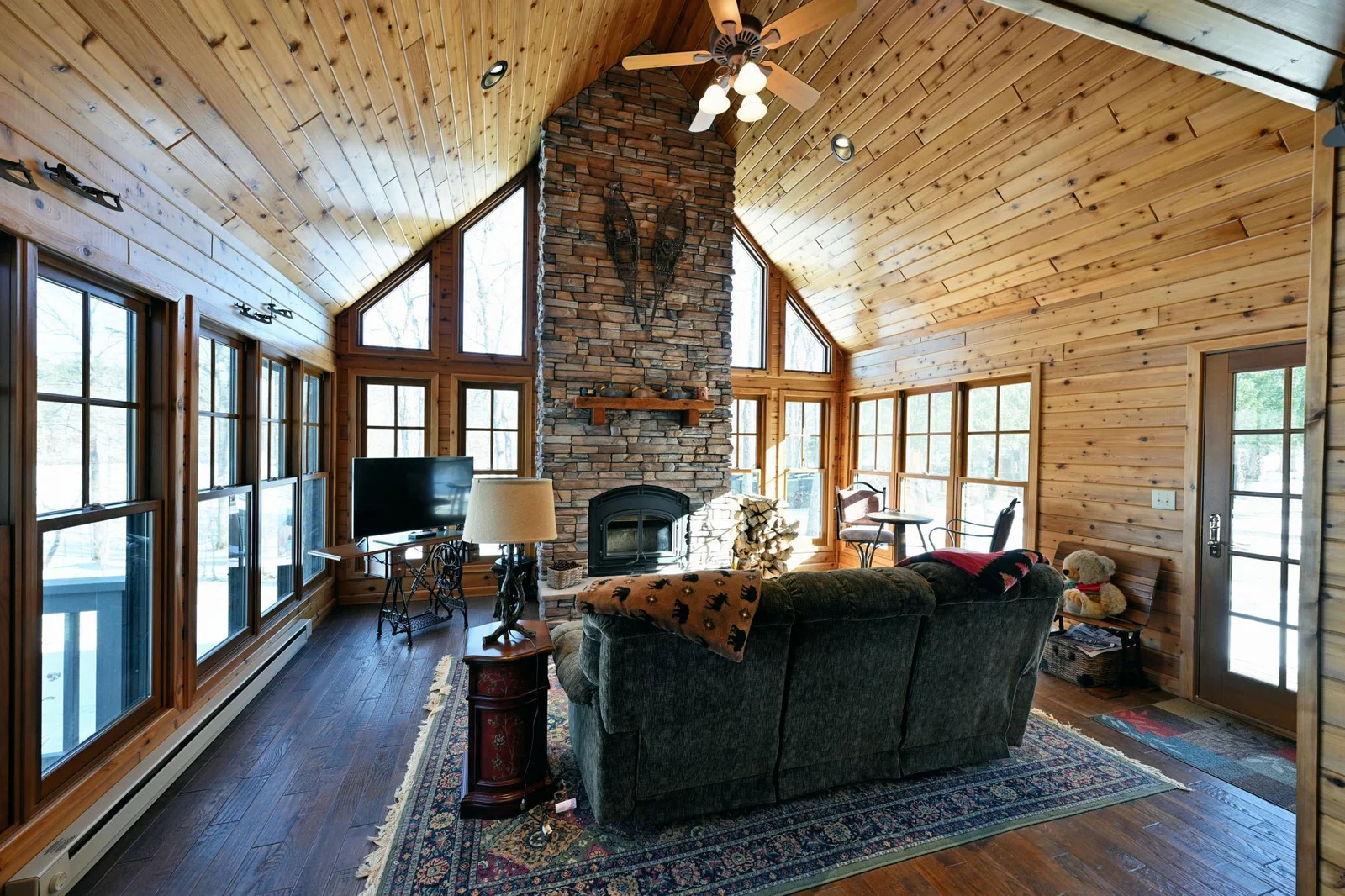 Recently added Sunroom with vaulted ceiling and cozy wood fireplace