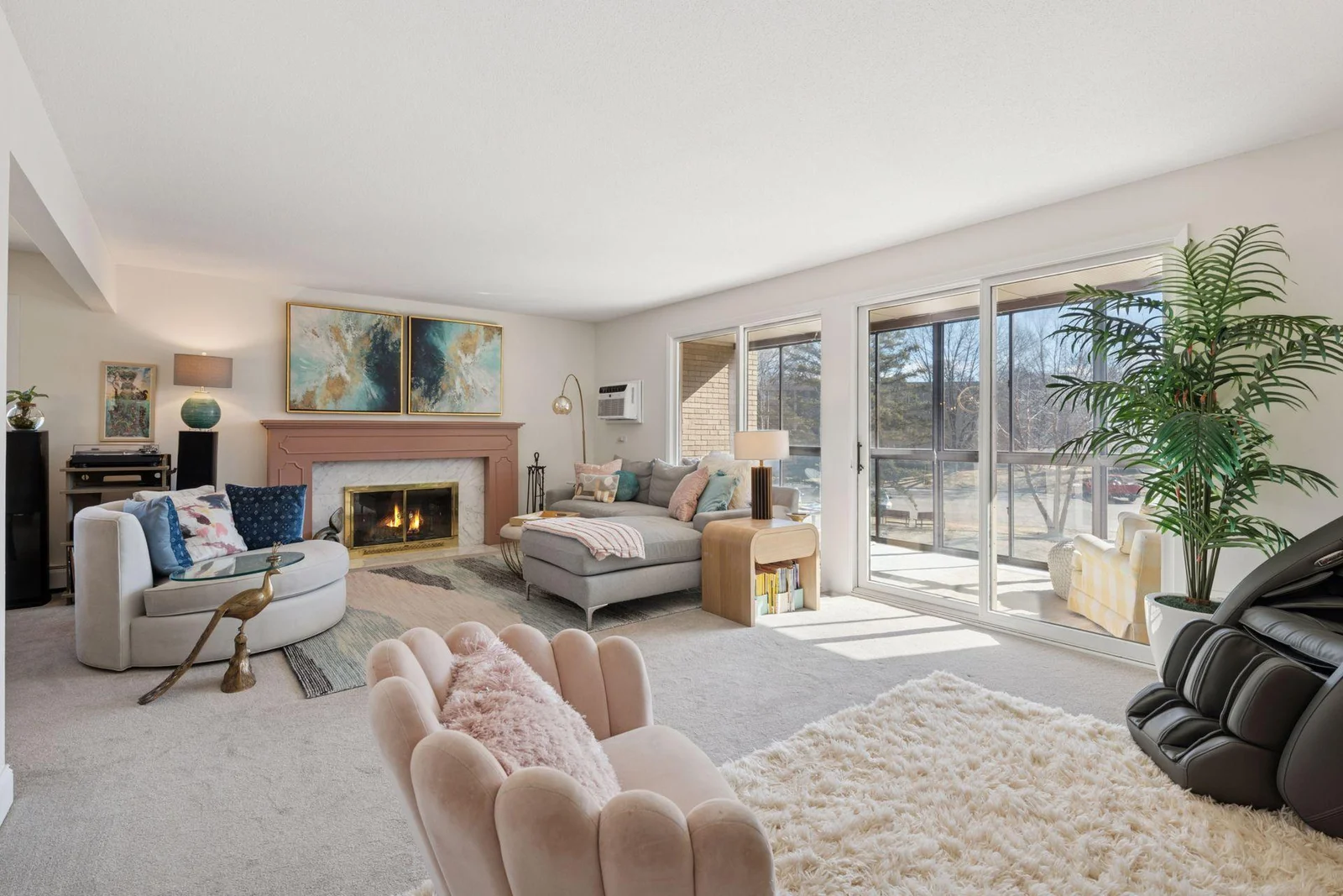 Living room with wood burning FP, new wall air conditioner which walks into sunroom
