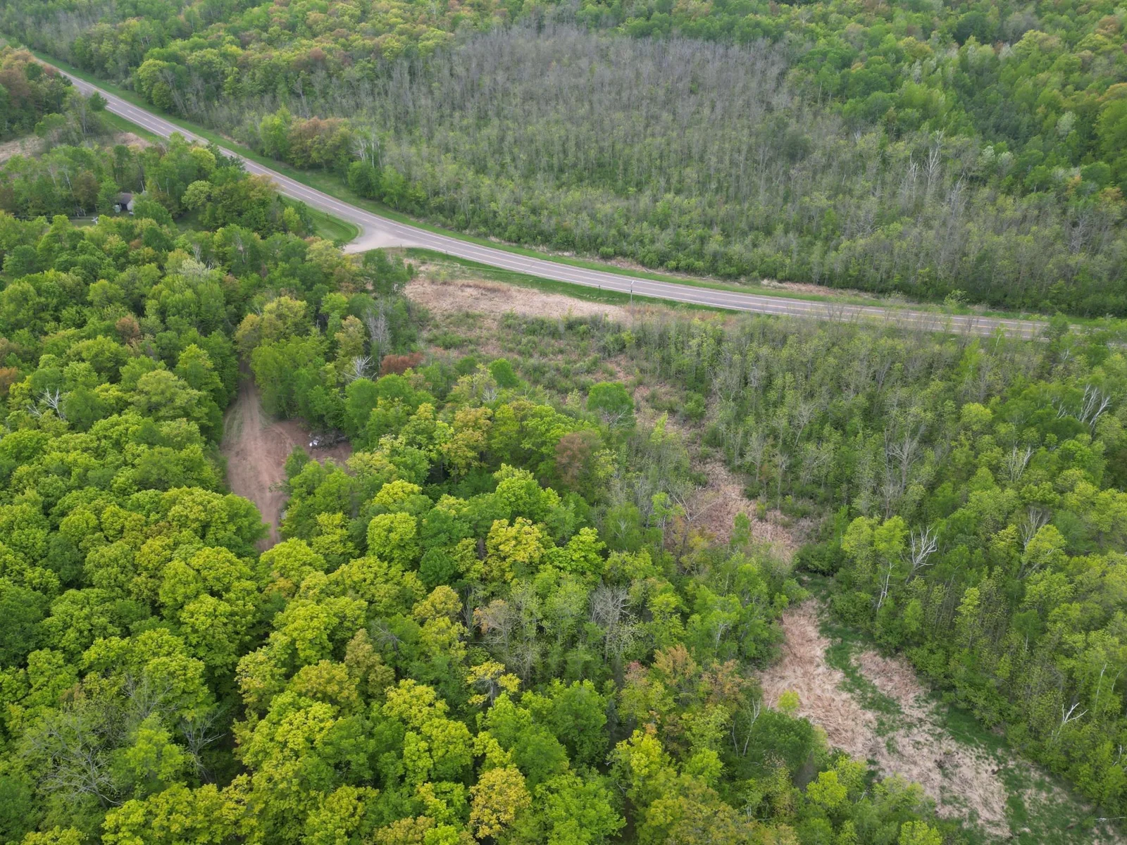Aerial view showing the property from the road.