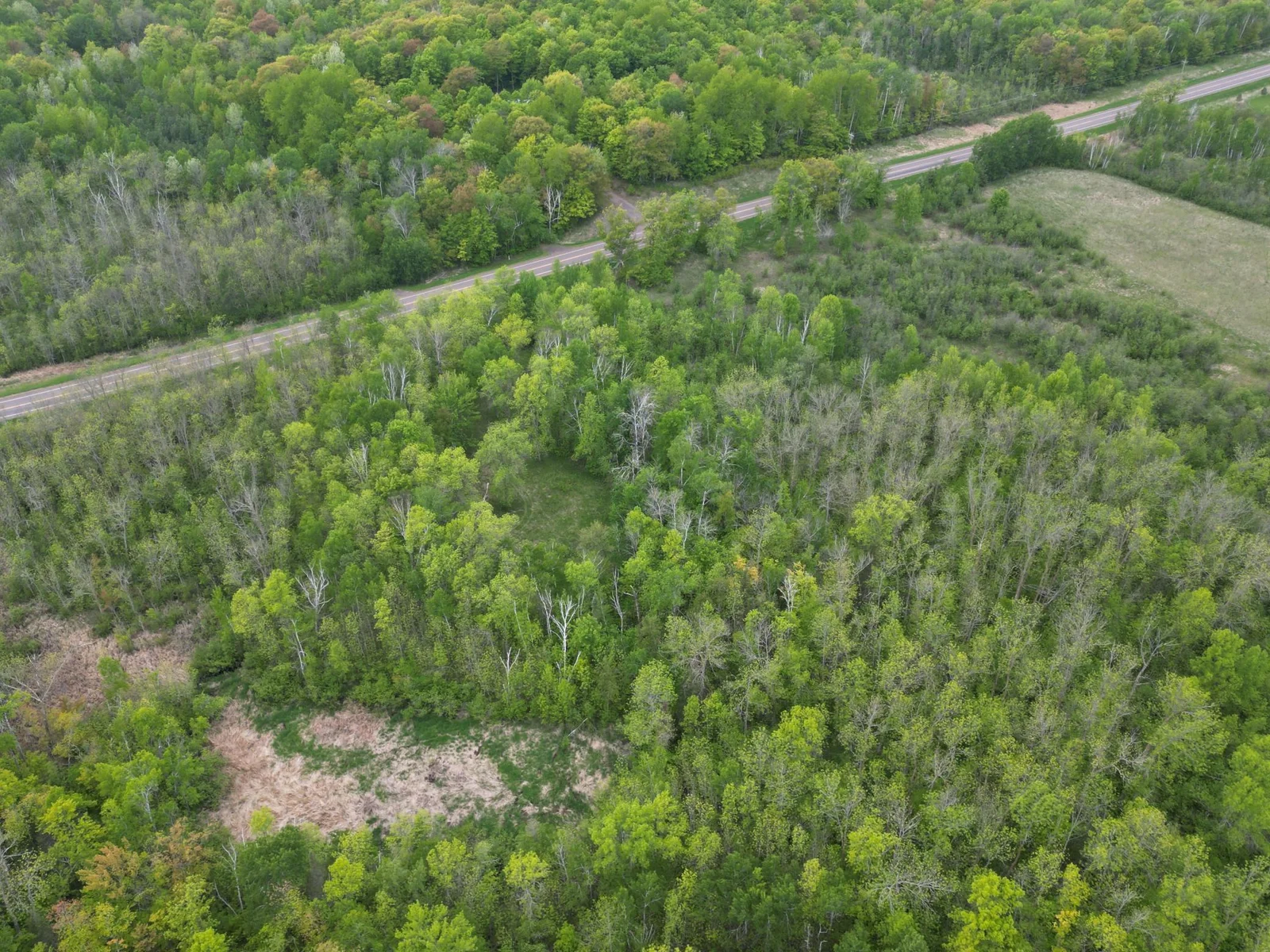 Aerial view showing County Rd 53 in the background.