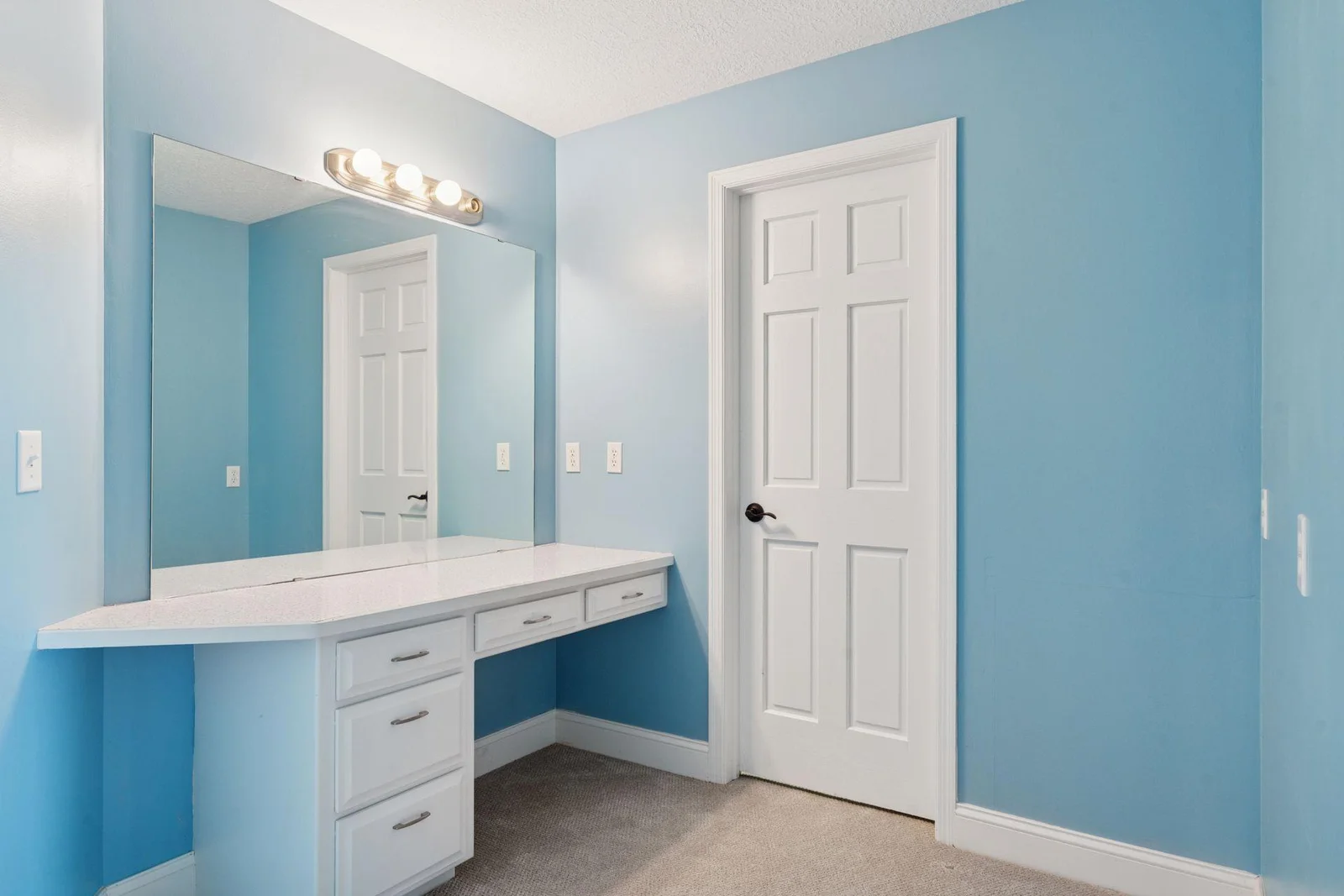 Lower Level Bedroom with vanity and walk-in closet