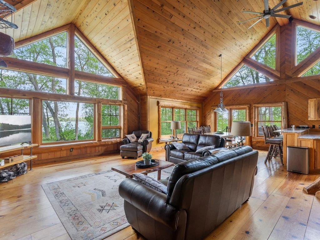 great room with tons of natural light. Furnishings are included - a turn key cabin