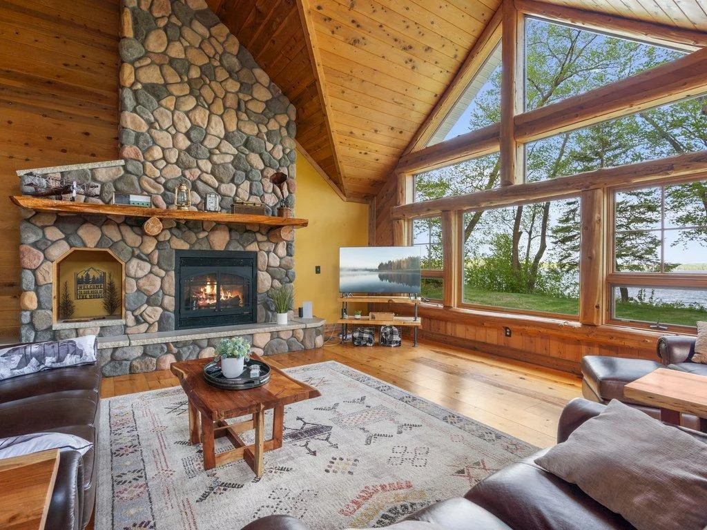 great room with wall of glass and LP fireplace