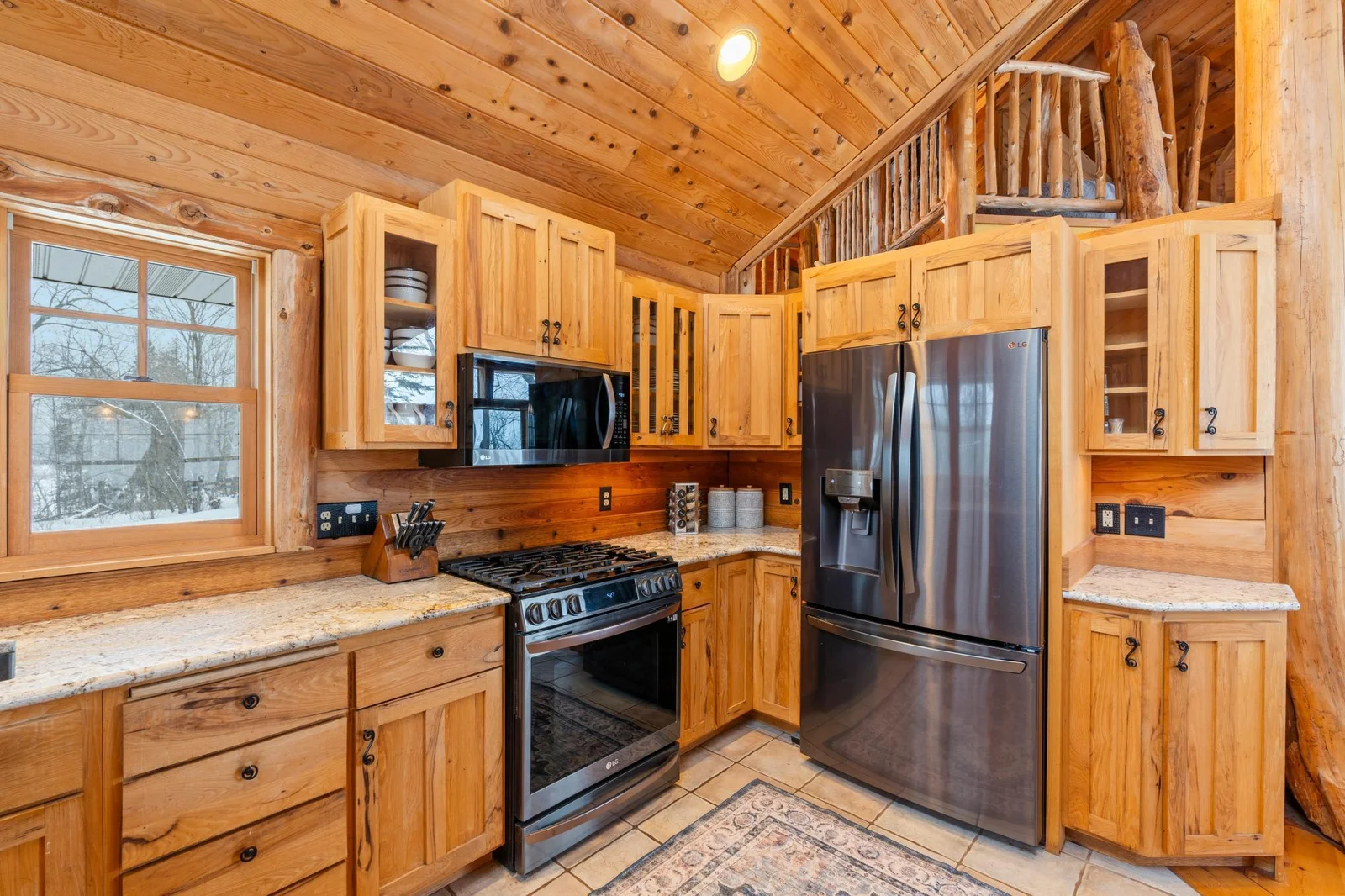 kitchen w custom cabinets and SS appliances