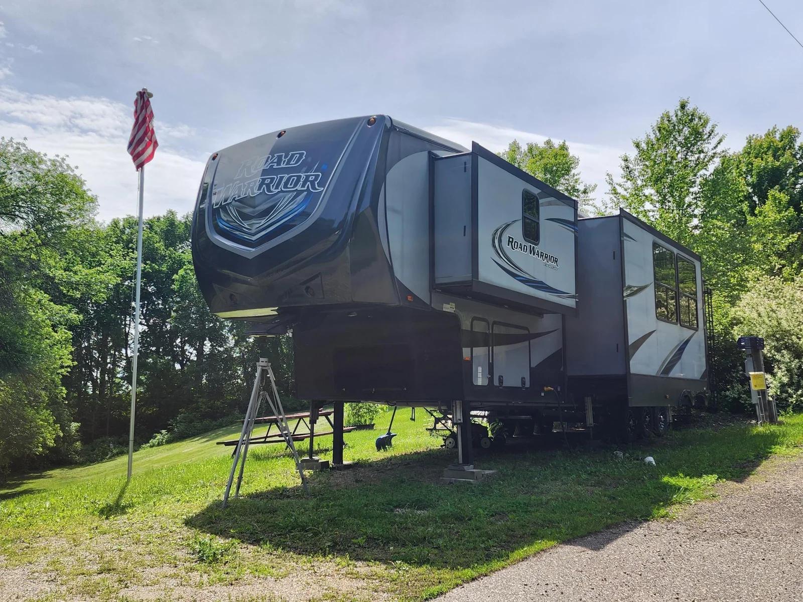 2017 427RW Road Warrior on private hillside unit at Cokato Lake RV Resort.  Tons of value!