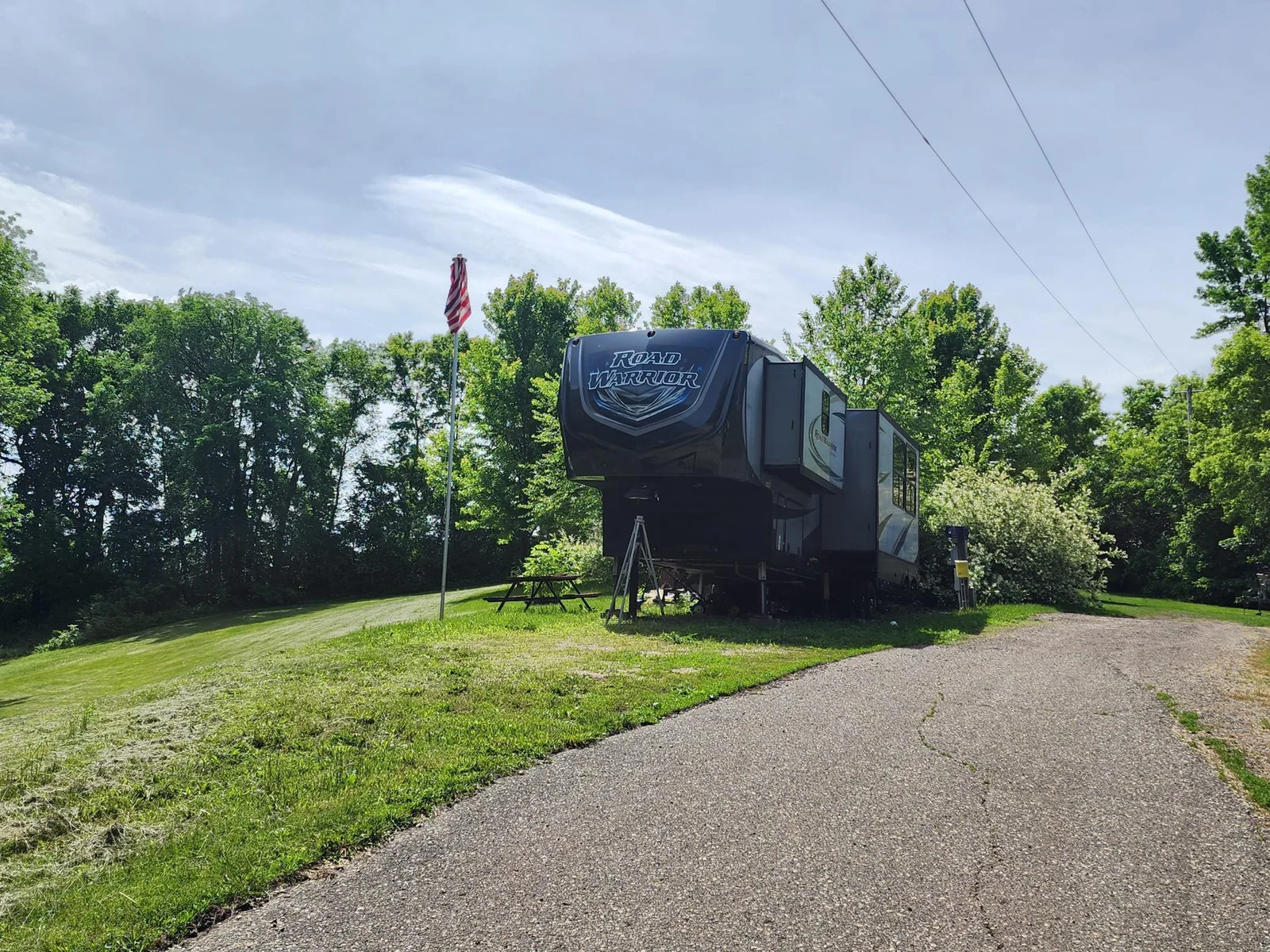 2017 427RW Road Warrior on private hillside unit at Cokato Lake RV Resort.  Tons of value!