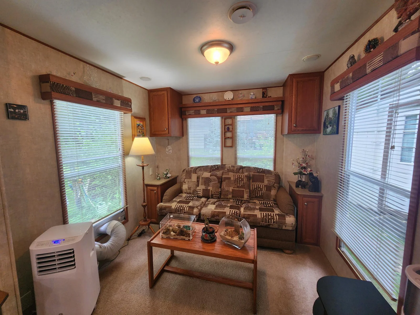Unit 109 Cokato Lake RV Resort Cooperative has a 2010 Breckenridge Destination RV and Quality-built Sun Room; ample parking, shed, outstanding landscaping and many other shared amenities including a 550 acre 50+ foot lake!