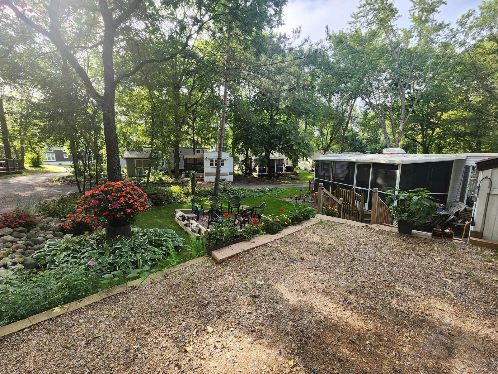 Unit 109 Cokato Lake RV Resort Cooperative has a 2010 Breckenridge Destination RV and Quality-built Sun Room; ample parking, shed, outstanding landscaping and many other shared amenities including a 550 acre 50+ foot lake!