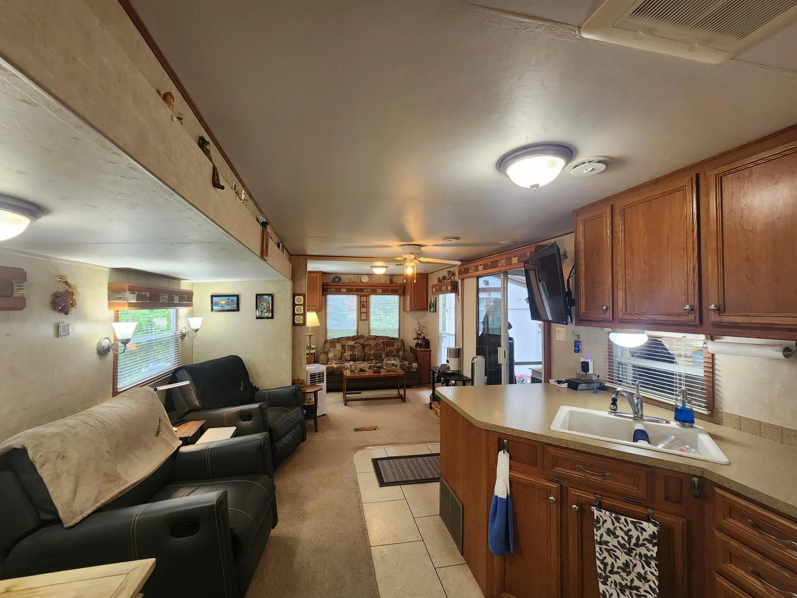Unit 109 Cokato Lake RV Resort Cooperative has a 2010 Breckenridge Destination RV and Quality-built Sun Room; ample parking, shed, outstanding landscaping and many other shared amenities including a 550 acre 50+ foot lake!