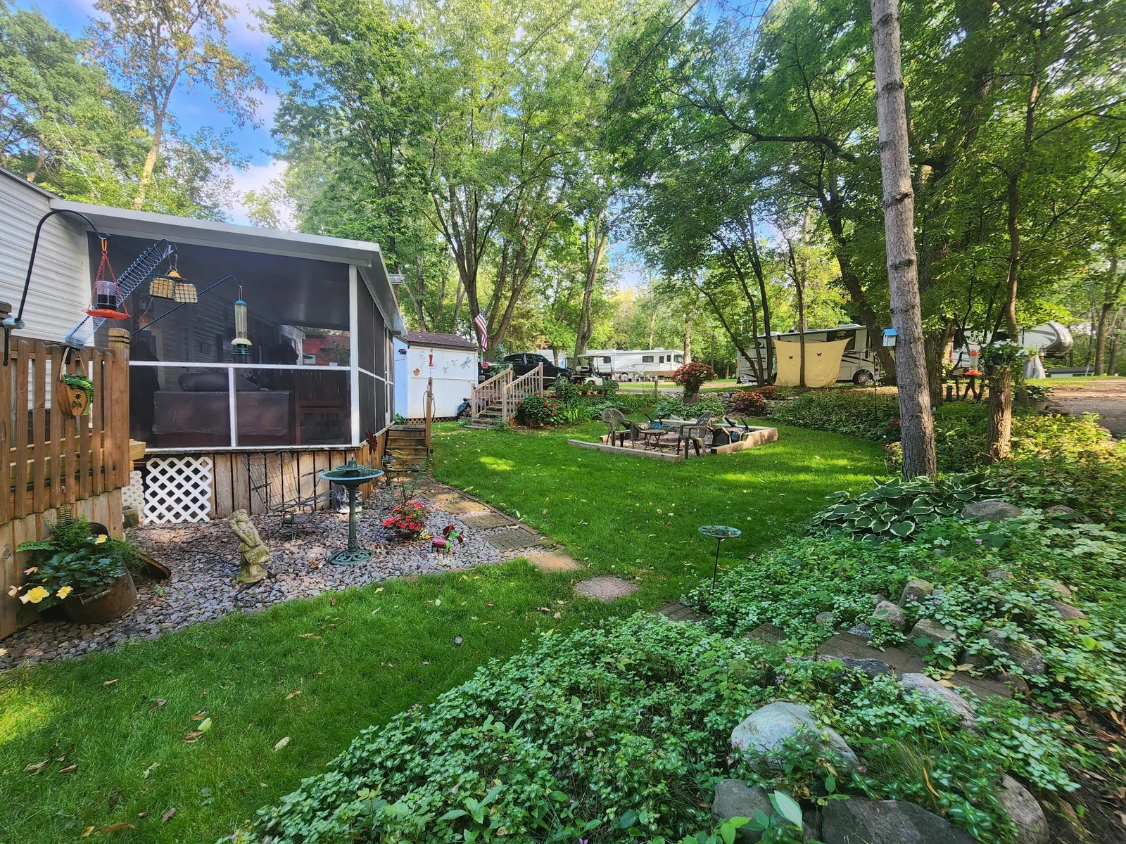 Unit 109 Cokato Lake RV Resort Cooperative has a 2010 Breckenridge Destination RV and Quality-built Sun Room; ample parking, shed, outstanding landscaping and many other shared amenities including a 550 acre 50+ foot lake!