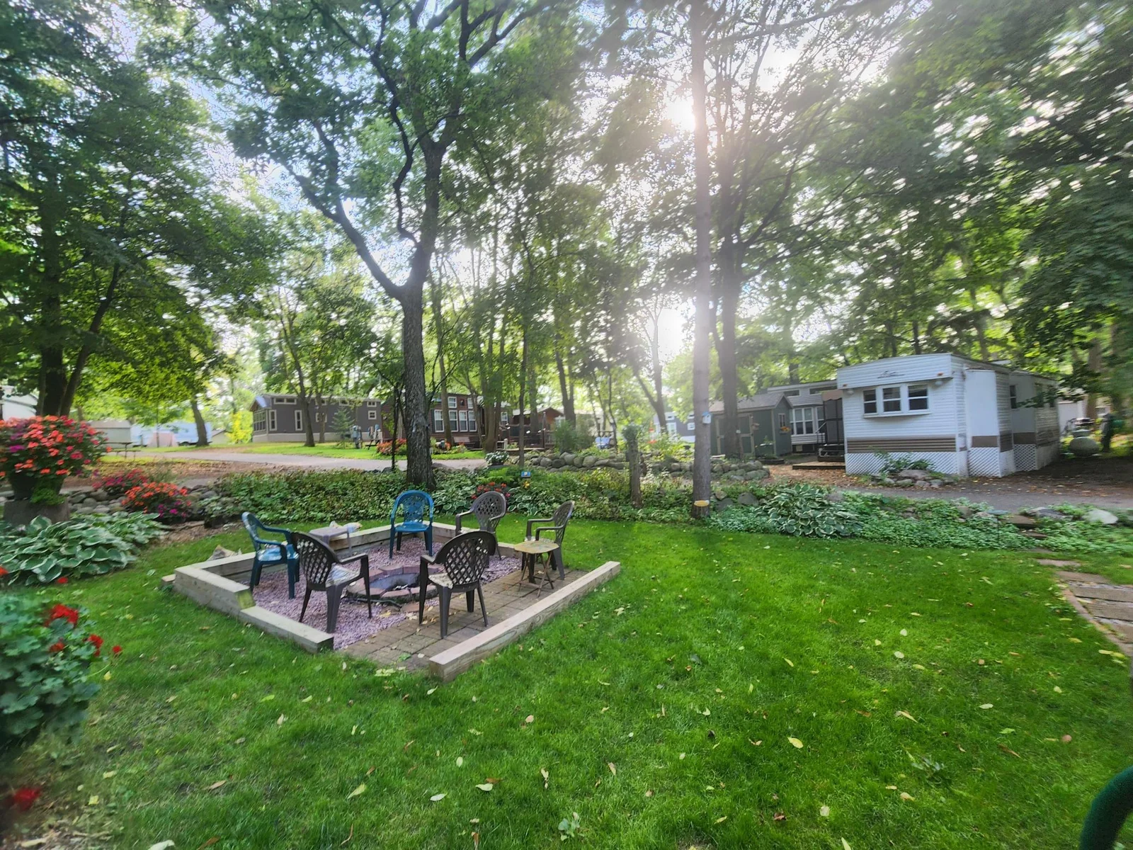 Unit 109 Cokato Lake RV Resort Cooperative has a 2010 Breckenridge Destination RV and Quality-built Sun Room; ample parking, shed, outstanding landscaping and many other shared amenities including a 550 acre 50+ foot lake!