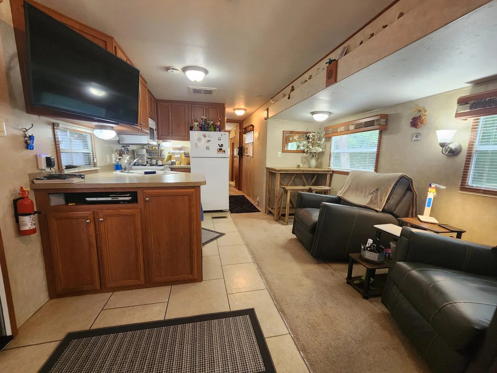 Unit 109 Cokato Lake RV Resort Cooperative has a 2010 Breckenridge Destination RV and Quality-built Sun Room; ample parking, shed, outstanding landscaping and many other shared amenities including a 550 acre 50+ foot lake!
