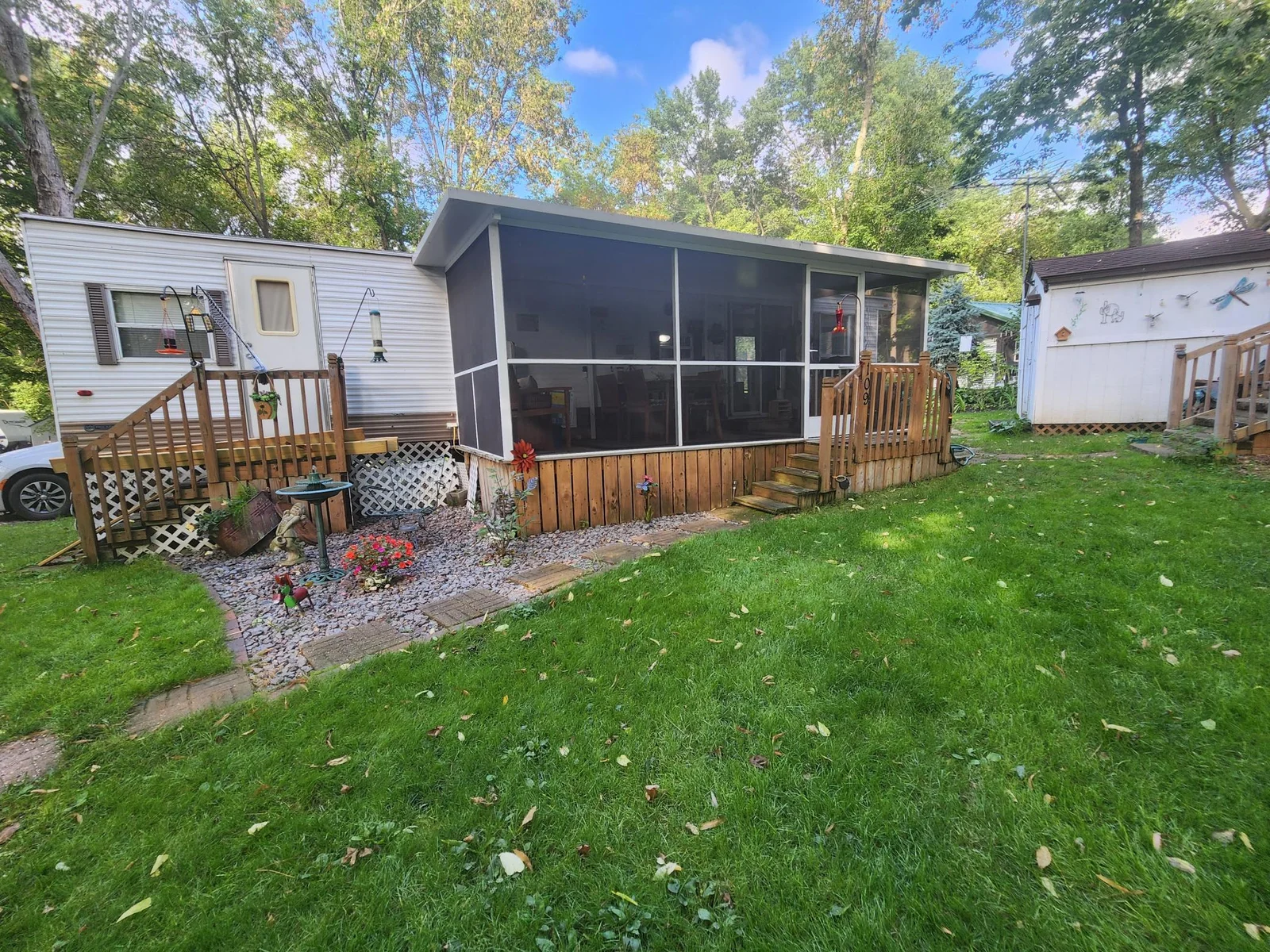 Unit 109 Cokato Lake RV Resort Cooperative has a 2010 Breckenridge Destination RV and Quality-built Sun Room; ample parking, shed, outstanding landscaping and many other shared amenities including a 550 acre 50+ foot lake!