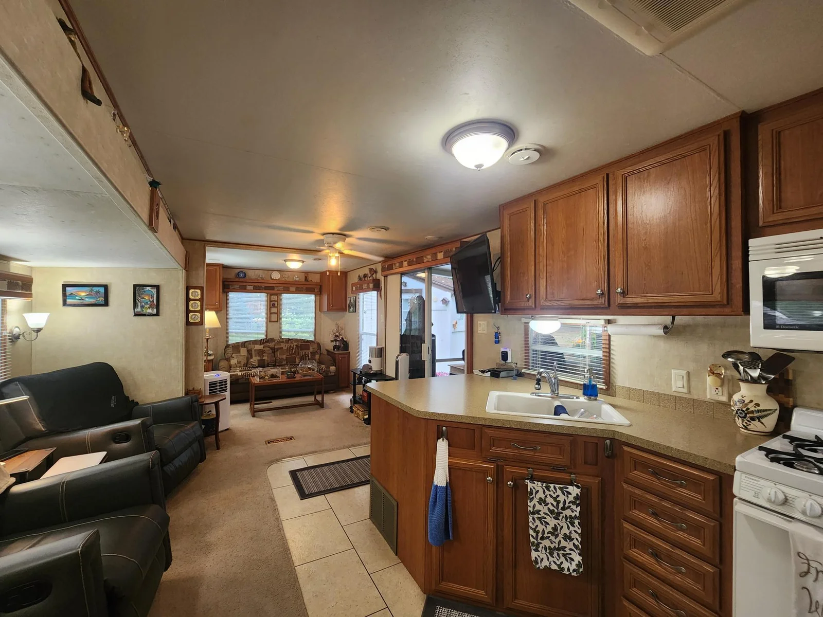 Unit 109 Cokato Lake RV Resort Cooperative has a 2010 Breckenridge Destination RV and Quality-built Sun Room; ample parking, shed, outstanding landscaping and many other shared amenities including a 550 acre 50+ foot lake!