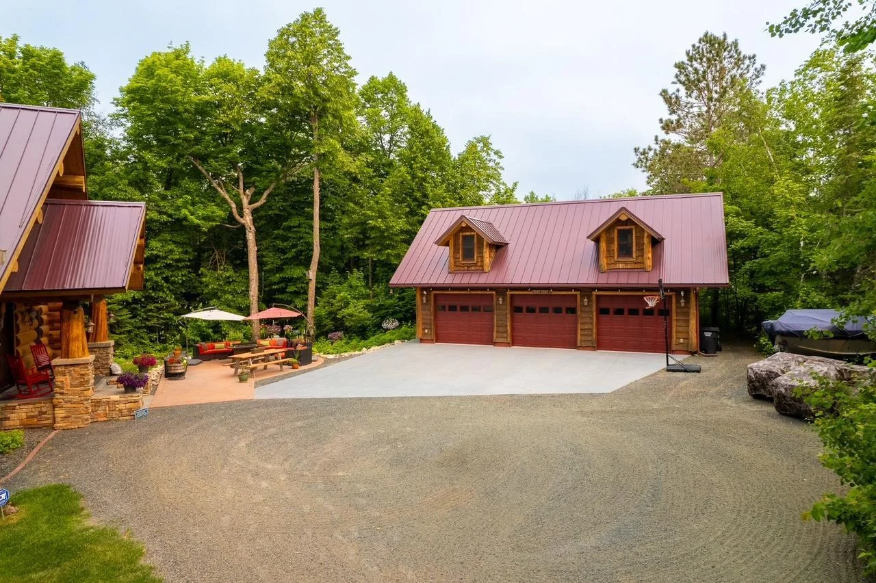 Home entry and three stall garage view